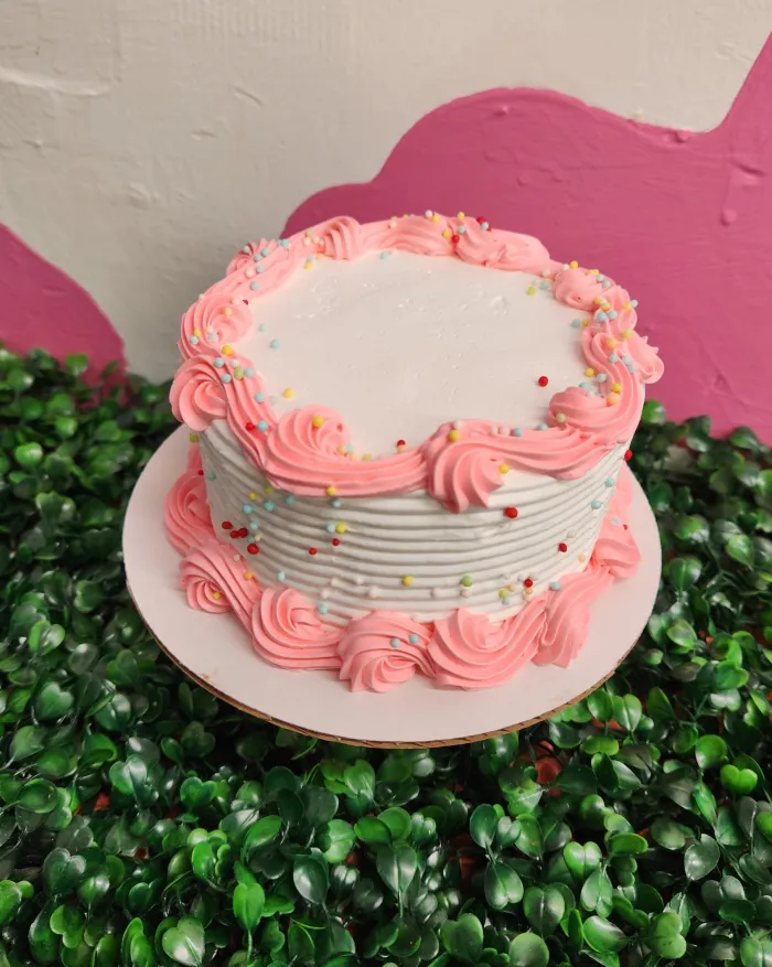 Pink-frosted ice cream cake